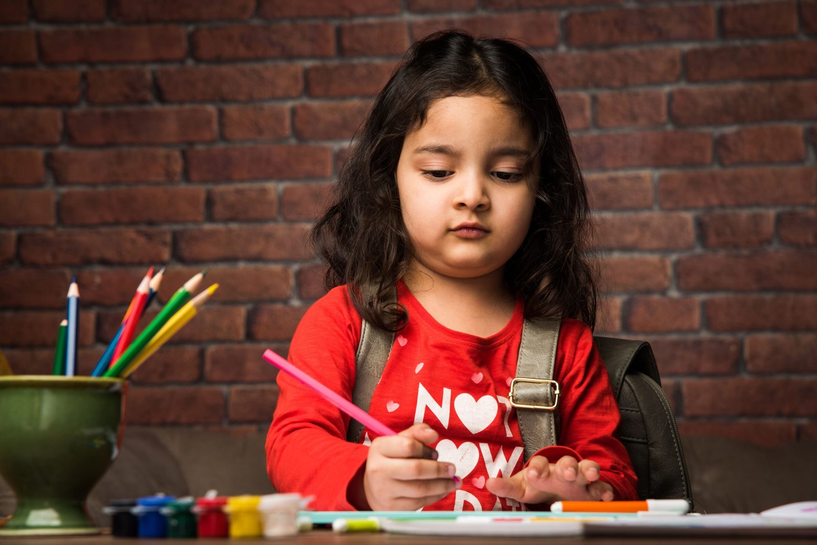 indian small girl drawing painting with colours paper selective focus 1 1 scaled